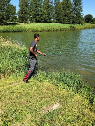 taking a water sample from a pond