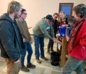 group of growers demonstrating a hand washing station