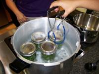 four jars in a water bath