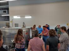 attendees learning about a washer